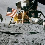 Moon Landing - Astronaut Standing Beside American Flag on the Moon