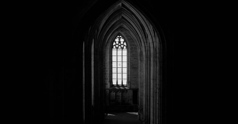 Architectural Feats - Monochrome Photo Of Dark Hallway