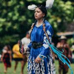 Pow Wow - Woman in a Traditional Native American Costume at a Pow Wow Gathering