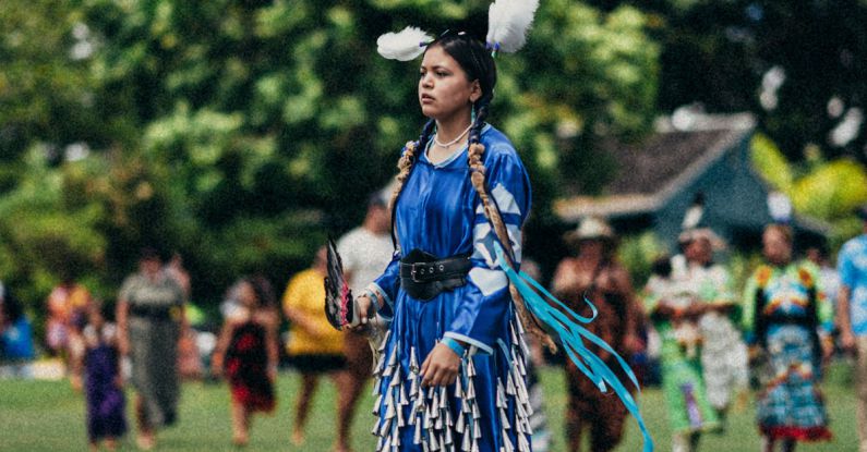 Pow Wow - Woman in a Traditional Native American Costume at a Pow Wow Gathering