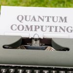 Quantum Mechanics - A typewriter with a paper that says quantum computing