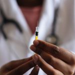 Vaccines - Person Holding Injection