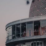 Scientific Breakthroughs - A building with a dome and a tree in front