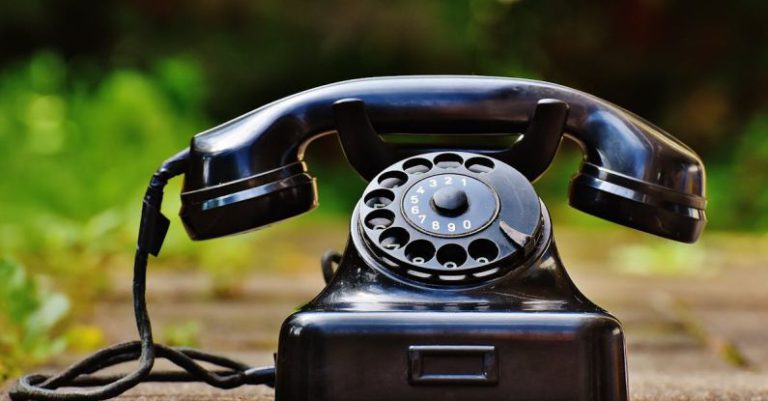 Telephone - Selective Focus Photography of Black Rotary Phone