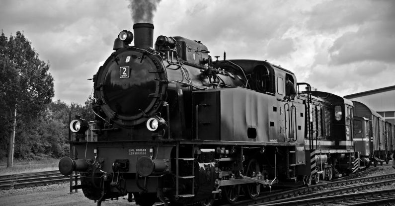Steam Engine - Train on Railroad Tracks Against Sky