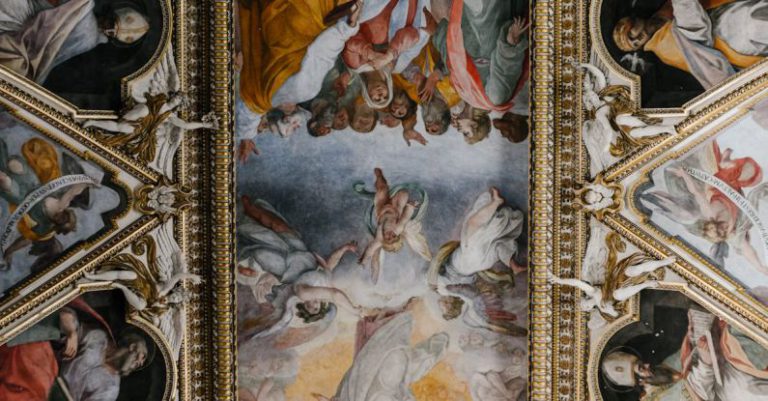 Baroque Art - From below dome ceiling covered with majestic colorful fresco paintings in Baroque style in Catholic cathedral