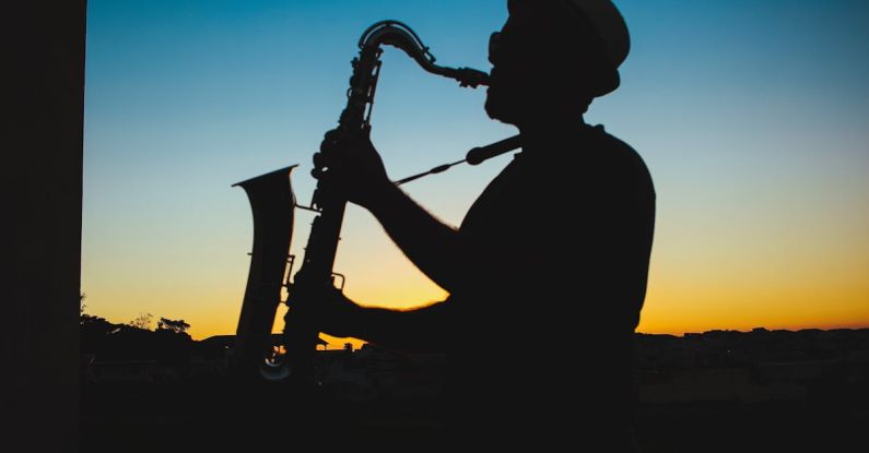 Jazz Music - Silhouette of a Man Playing Saxophone during Sunset