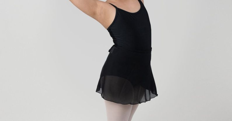 Ballets - A young girl in a black tutu and ballet shoes