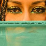 Egyptian Mythology - Woman with Makeup and Braided Hair behind Green Veil