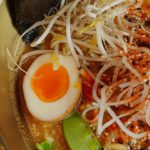 Japanese Mythology - A bowl of ramen with noodles, eggs and other ingredients
