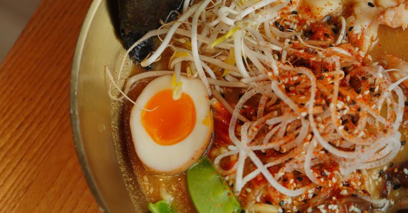 Japanese Mythology - A bowl of ramen with noodles, eggs and other ingredients